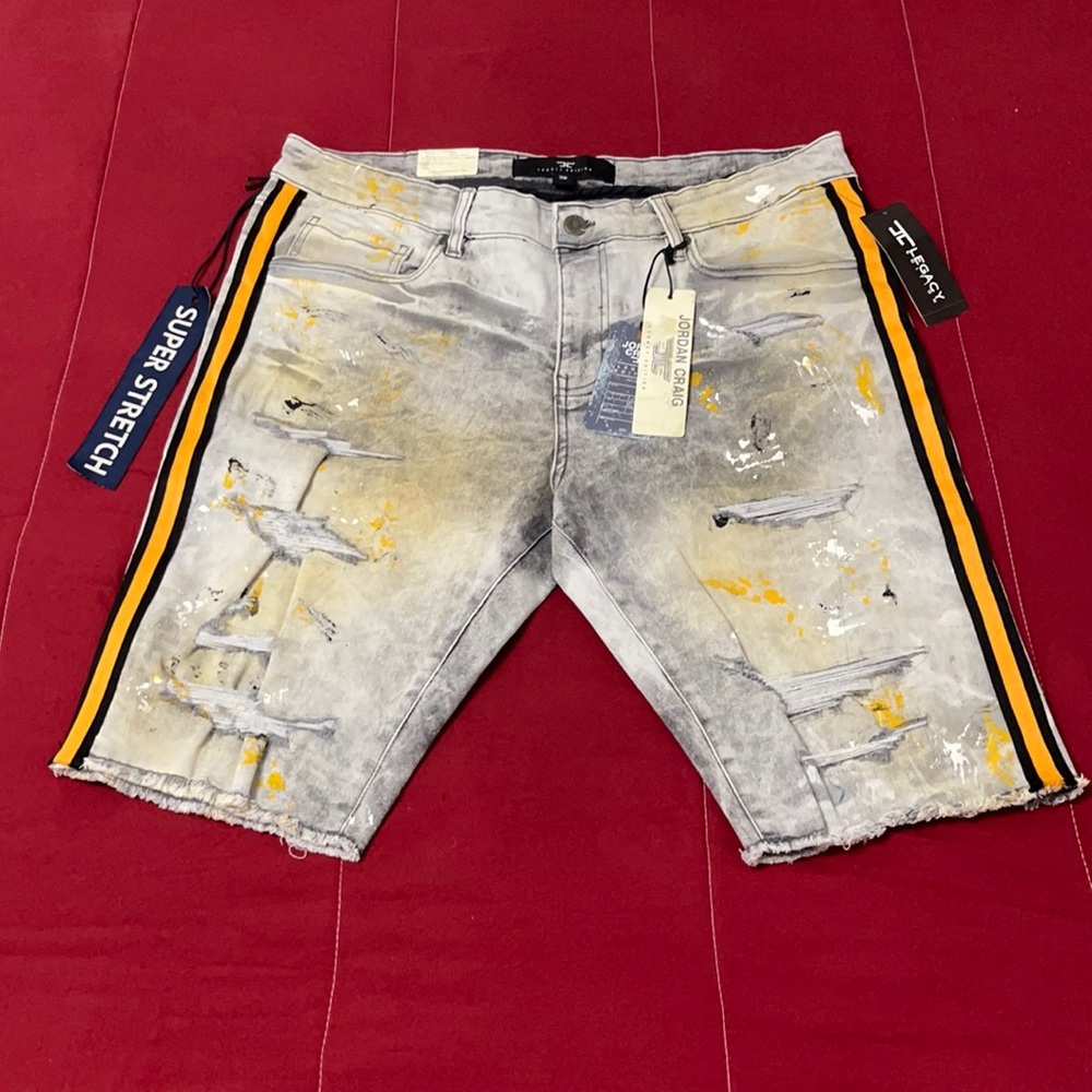 These “Legacy loaded” grey jeans are splashed with gold for an enhanced look
